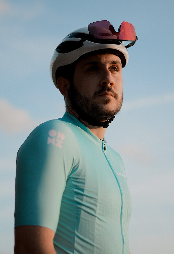 Male rider wearing moment jersey